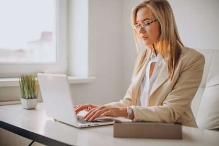 Women typing on the laptop
